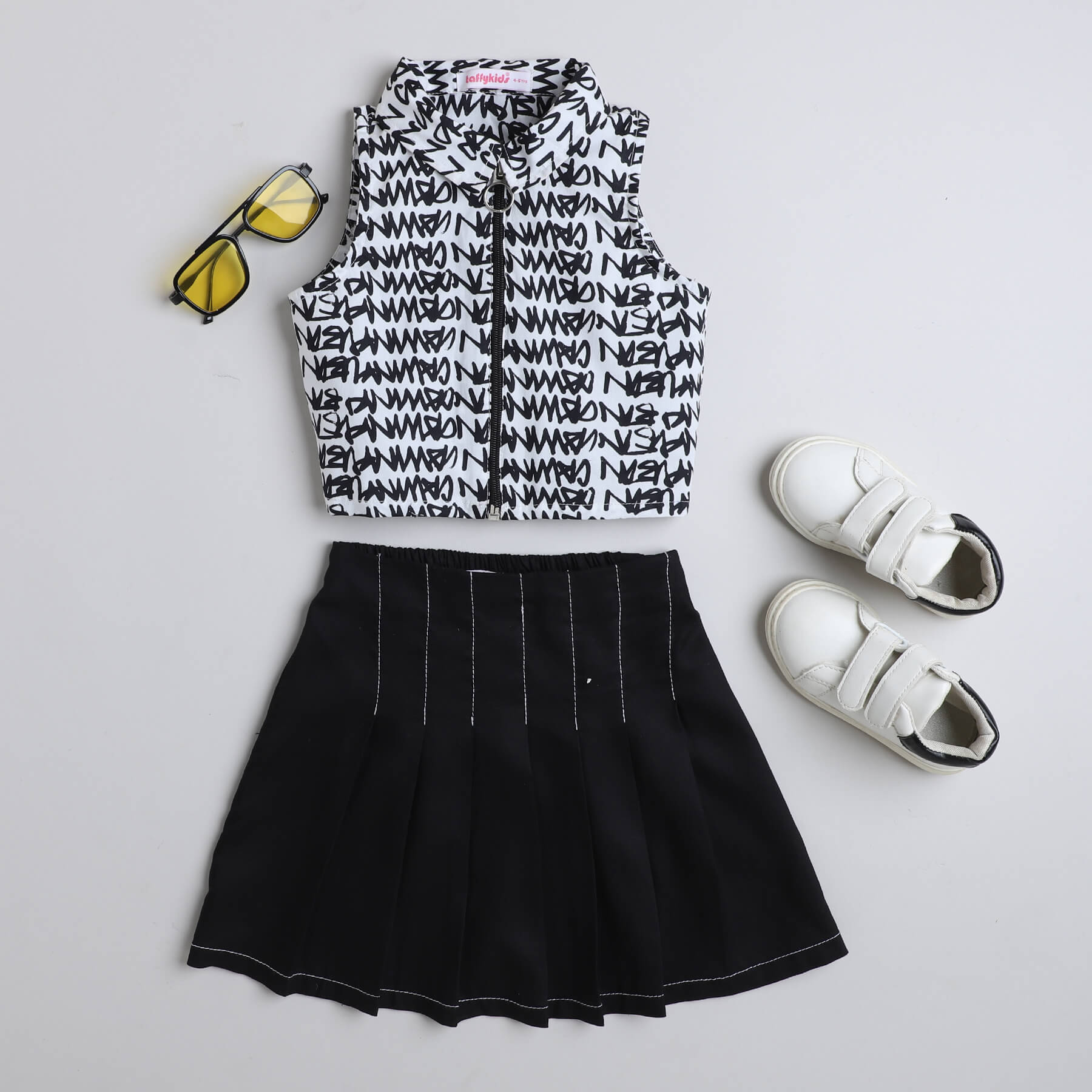 Taffykids 100% viscose Typographic printed sleeveless  collared zip up crop top and solid stitch detail pleated skirt set-Black/White