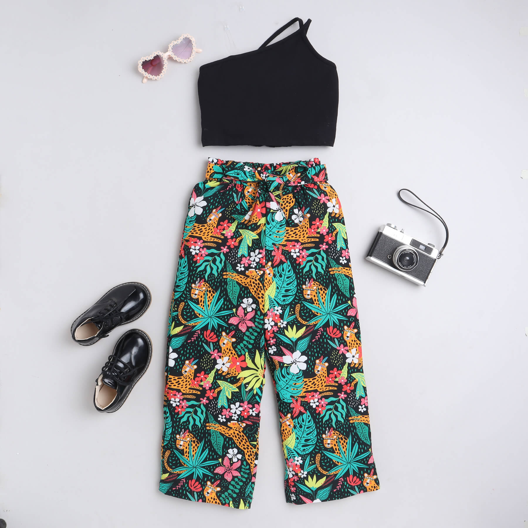 sleeveless asymmetric neck crop top and Tropical animal printed paper waist tie up belt pant set-Black/Multi