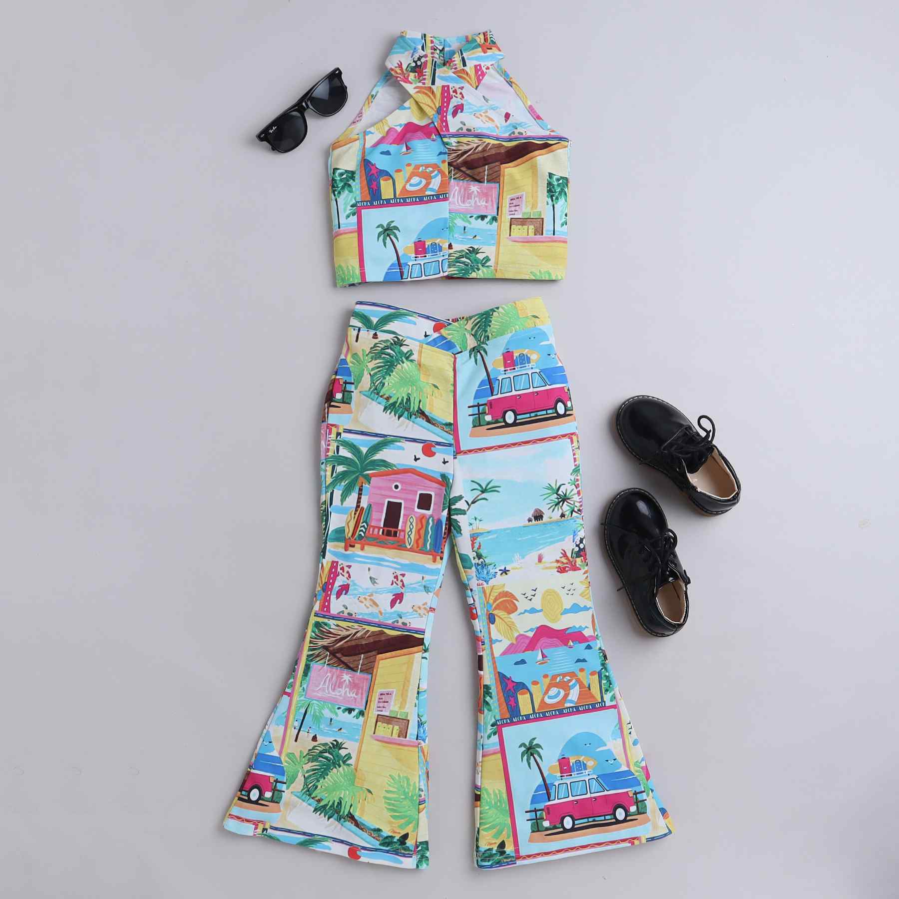 graphic printed sleeveless halter neck crop top and matching V waist bell bottom pant set-Multi