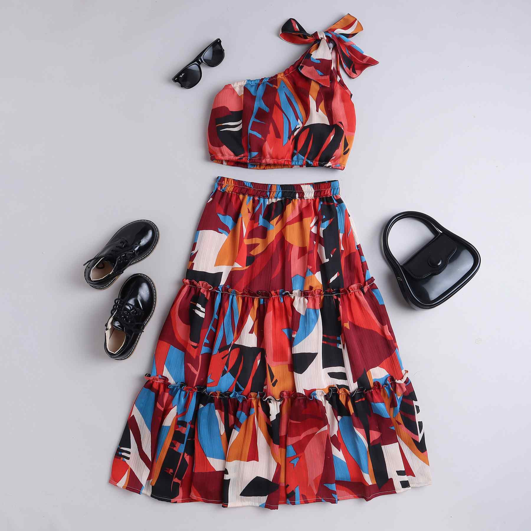 abstract printed one shoulder crop top with matching tired skirt set - Maroon