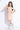 Rushed detailed sleeveless halter neck tie-up crop top with matching skort set- Peach